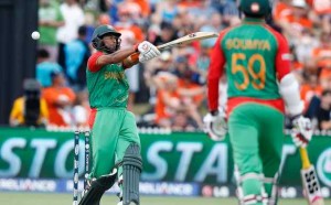 Bangladesh's+MD+Mahmud+Ullah+(L)+swings+and+misses+during+their+Cricket+World+Cup+match+against+New+Zealand